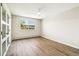 Bright bedroom featuring modern floors, ceiling fan, and a large window with natural light at 725 S Alton Way # 9C, Denver, CO 80247