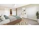 Well-lit staged bedroom boasting an en-suite bathroom and a ceiling fan at 725 S Alton Way # 9C, Denver, CO 80247