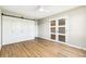 Bedroom with modern wood floors, sliding closet doors and bright natural lighting at 725 S Alton Way # 9C, Denver, CO 80247