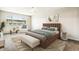 Stylishly staged bedroom featuring a large window, ceiling fan, and an accent rug at 725 S Alton Way # 9C, Denver, CO 80247