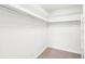 Spacious walk-in closet with ample storage space and neutral carpeting at 725 S Alton Way # 9C, Denver, CO 80247