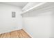 Walk-in closet with storage shelves, with vinyl wood floors and neutral walls at 725 S Alton Way # 9C, Denver, CO 80247