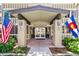 Welcoming entrance with flags, planters, and clear signage, leading to glass doors at 725 S Alton Way # 9C, Denver, CO 80247