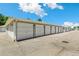 A long row of detached garages in a well-maintained storage area for the property at 725 S Alton Way # 9C, Denver, CO 80247