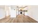 Open-concept kitchen with white cabinets and stainless steel appliances at 725 S Alton Way # 9C, Denver, CO 80247