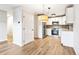Bright kitchen with stainless appliances and shaker style cabinetry with black hardware at 725 S Alton Way # 9C, Denver, CO 80247