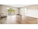 Bright and airy living room with wood floors and a sliding door to a balcony at 725 S Alton Way # 9C, Denver, CO 80247