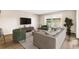 Modern living room showcasing a comfortable sofa, TV, and access to a balcony at 725 S Alton Way # 9C, Denver, CO 80247