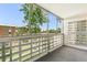 Spacious enclosed patio with large windows, offering views of the surrounding greenery at 725 S Alton Way # 9C, Denver, CO 80247