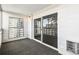 Bright enclosed patio with large windows and a sliding glass door to the living space at 725 S Alton Way # 9C, Denver, CO 80247