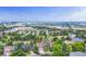 An aerial view of a home in a tree-lined neighborhood, conveniently located near shopping and highways at 8441 S Timberwood St, Highlands Ranch, CO 80126