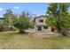Spacious backyard with stone patio, and lush green lawn at 8441 S Timberwood St, Highlands Ranch, CO 80126