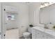 Bathroom with a single sink vanity and tiled floors, offering a clean and functional space at 8441 S Timberwood St, Highlands Ranch, CO 80126