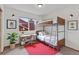 Bedroom featuring desk, window, bunk bed, and plant at 8441 S Timberwood St, Highlands Ranch, CO 80126