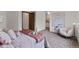Spacious bedroom with neutral carpeting, walk in closet and sitting area at 8441 S Timberwood St, Highlands Ranch, CO 80126