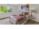 Serene bedroom features neutral colors, natural light, and stylish decor, creating a peaceful and inviting retreat at 8441 S Timberwood St, Highlands Ranch, CO 80126