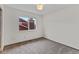 Empty bedroom with neutral carpet and window at 8441 S Timberwood St, Highlands Ranch, CO 80126