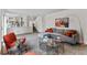 Spacious living area featuring comfortable seating, modern decor, and seamlessly blending style and functionality at 8441 S Timberwood St, Highlands Ranch, CO 80126