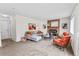 Open living room with fireplace, ample seating, and decor, creating a perfect space for relaxation and entertainment at 8441 S Timberwood St, Highlands Ranch, CO 80126