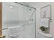Walk-in shower with tiled walls and glass door at 8441 S Timberwood St, Highlands Ranch, CO 80126