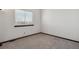 Neutral bedroom with gray carpet and window with blinds, ready for personalization at 8293 S Reed St, Littleton, CO 80128