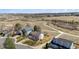 An aerial view of houses along the street near an open field under a bright and sunny sky at 5667 W 109Th Cir, Westminster, CO 80020