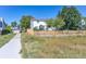 View of the property's back exterior and fenced yard from the public walking path at 5667 W 109Th Cir, Westminster, CO 80020
