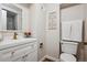 Bathroom features a white vanity with gold fixtures, toilet, and shower at 5667 W 109Th Cir, Westminster, CO 80020