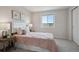 Cozy bedroom featuring large window and carpeted floors at 5667 W 109Th Cir, Westminster, CO 80020