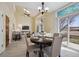 Bright dining area with decorative window and sliding door leading to the outdoors at 5667 W 109Th Cir, Westminster, CO 80020