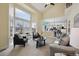 Spacious living room showcasing large windows, neutral decor, and an open layout at 5667 W 109Th Cir, Westminster, CO 80020