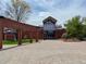 The exterior of the recreation center is red brick with glass doors in front of a courtyard entrance at 5667 W 109Th Cir, Westminster, CO 80020