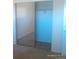 A bedroom closet with mirrored doors, a shelf, and clothes rod at 10762 E Exposition Ave. Ave # 137, Aurora, CO 80012