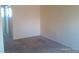 A large bedroom with neutral paint and carpet at 10762 E Exposition Ave. Ave # 137, Aurora, CO 80012