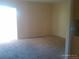 A sunny living room with neutral paint and carpet at 10762 E Exposition Ave. Ave # 137, Aurora, CO 80012