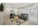 A finished basement featuring a modern rug and comfortable seating at 16277 Talons Bluff Ln, Monument, CO 80132