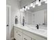 Bathroom with double vanity, sleek black fixtures, and minimalist design for a modern feel at 16277 Talons Bluff Ln, Monument, CO 80132