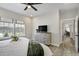 Comfortable bedroom featuring hard surface floors, ceiling fan and neutral paint at 16277 Talons Bluff Ln, Monument, CO 80132