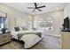 Bright bedroom with natural light, ceiling fan, hard surface floors and neutral paint at 16277 Talons Bluff Ln, Monument, CO 80132