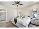 Bedroom showcasing hard surface floors, neutral paint and ensuite bathroom at 16277 Talons Bluff Ln, Monument, CO 80132