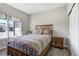 Bedroom boasting hard surface floors, a window and rustic wood frame bed at 16277 Talons Bluff Ln, Monument, CO 80132