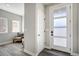 Bright entryway featuring modern door and hardwood flooring at 16277 Talons Bluff Ln, Monument, CO 80132