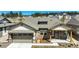 A charming home with a well-manicured lawn and neutral toned exterior at 16277 Talons Bluff Ln, Monument, CO 80132