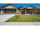 Attractive single-Gathering home with a well-kept lawn, covered entryway, and attached two-car garage at 16277 Talons Bluff Ln, Monument, CO 80132
