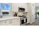 Charming kitchen featuring stainless steel appliances, stylish countertops, and bright natural light at 16277 Talons Bluff Ln, Monument, CO 80132