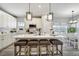 Spacious kitchen island features seating and open layout, perfect for entertaining at 16277 Talons Bluff Ln, Monument, CO 80132