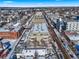 Aerial view of apartment buildings and neighborhood streets in winter at 4383 Tennyson St # 1A, Denver, CO 80212