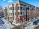 Aerial view of a brick building in a snowy neighborhood at 4383 Tennyson St # 1A, Denver, CO 80212