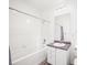 Clean bathroom with white tile and a bathtub at 4383 Tennyson St # 1A, Denver, CO 80212