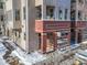 Brick building exterior with snow-covered sidewalk at 4383 Tennyson St # 1A, Denver, CO 80212